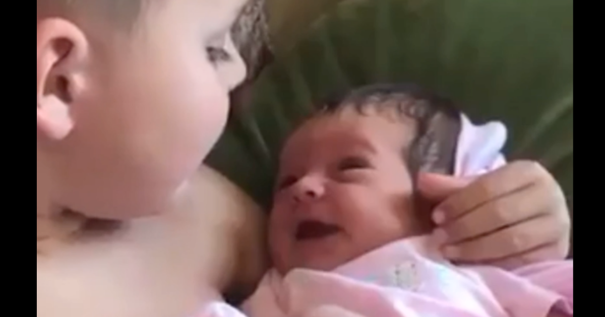 Boy Holds Baby Sister For The First Time And Serenades Her With “What A Wonderful World”